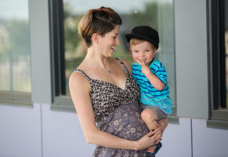 Image of a mother holding her young child