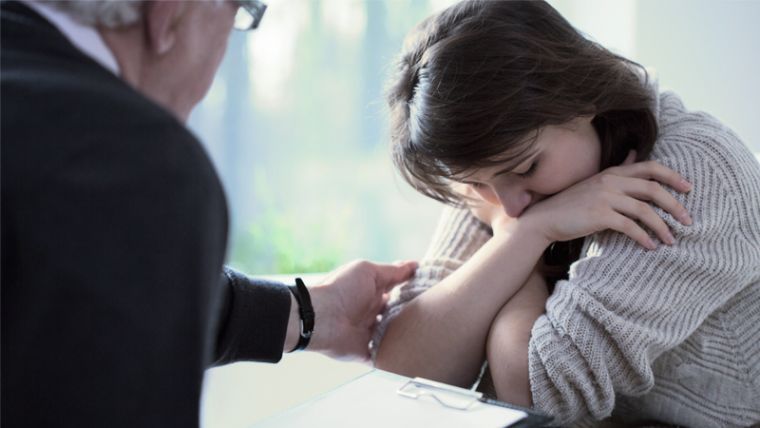 Counsellor working with a client