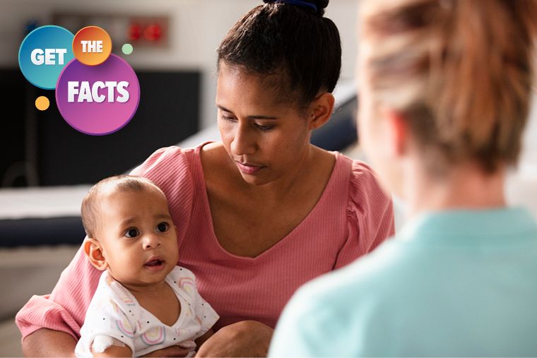 image of a mother holding her baby sitting opposite an immunisation provider