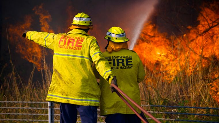 image of two firefighters in a bushfire