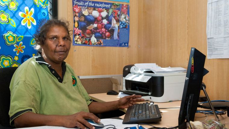 Aboriginal health worker at a computer