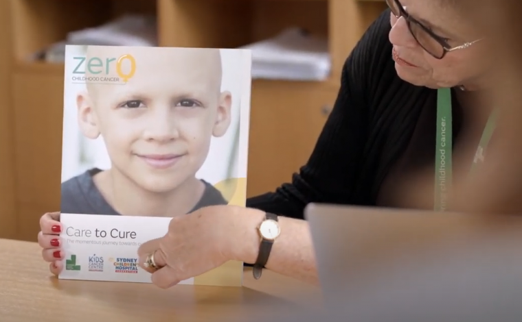 Doctor points to Zero Childhood Cancer brochure