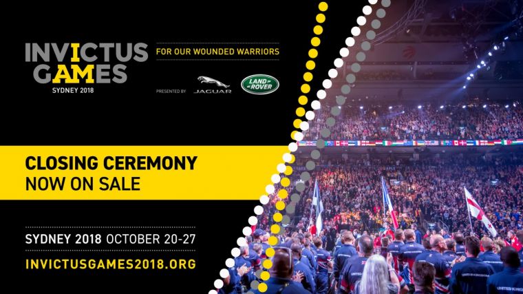 Crowd of people in a stadium for a sporting event. Invictus Games - for our wounded warriors. Closing ceremony now on sale. Sydney 2018 October 20 to 27. Invictusgames2018.org