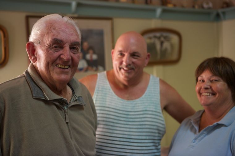 Older man and middle aged man in home setting