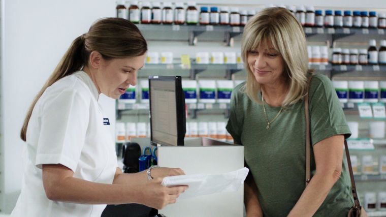 pharmacist with a customer