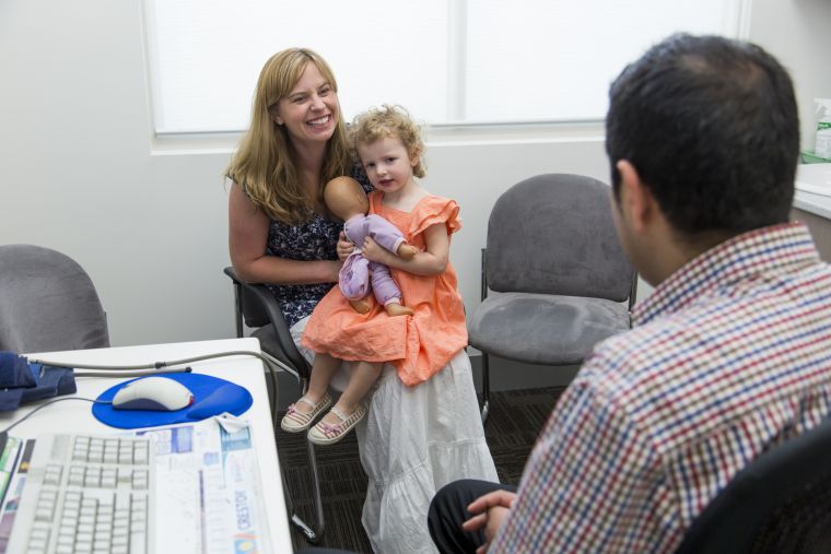 Image of a mother and daughter in a doctors surgery speaking to a GP