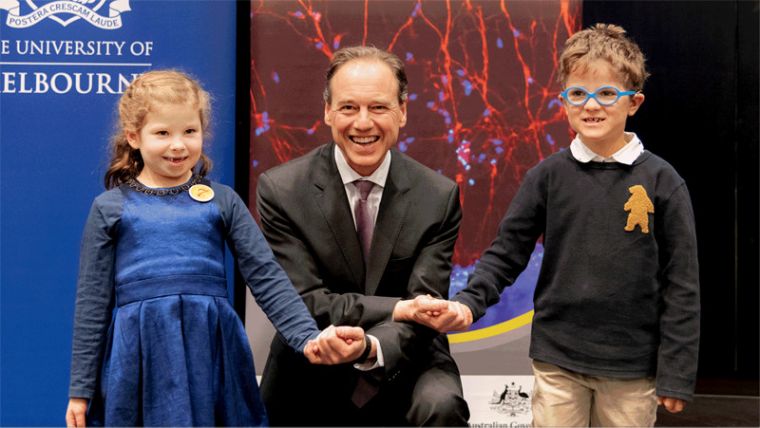 Yve Rumble and Harry Feller holding Minister Hunt’s hand at the Stem Cell announcement on 31 July.
