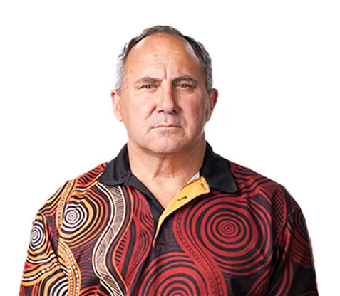 First Nations man wearing shirt with Indigenous artwork print
