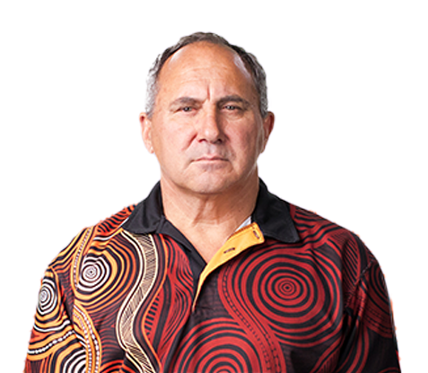 First Nations man wearing shirt with Indigenous artwork print