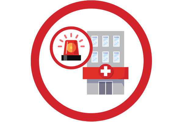 Flashing emergency light with a hospital building in the background