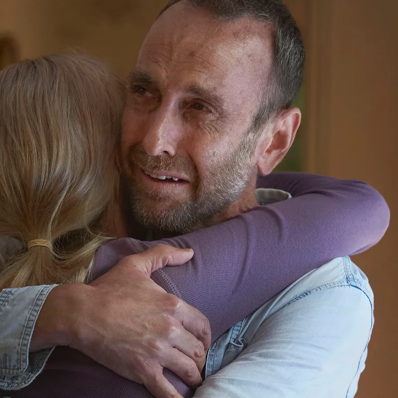 Woman hugging man