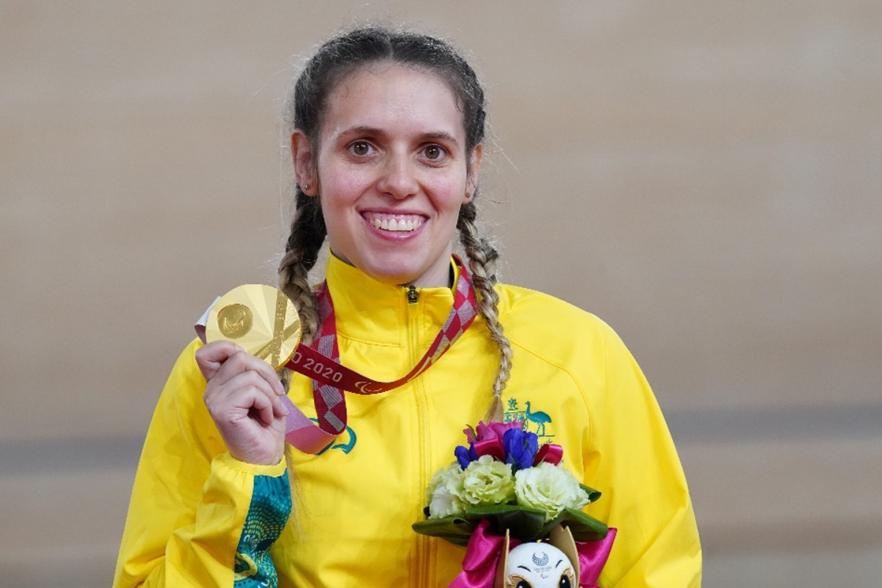 Photo of Amanda Reid with her Paralympic Gold medal in cycling