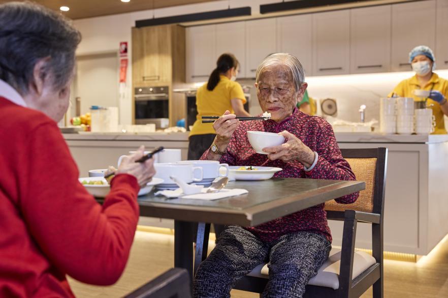 Photo of older ethic women eating
