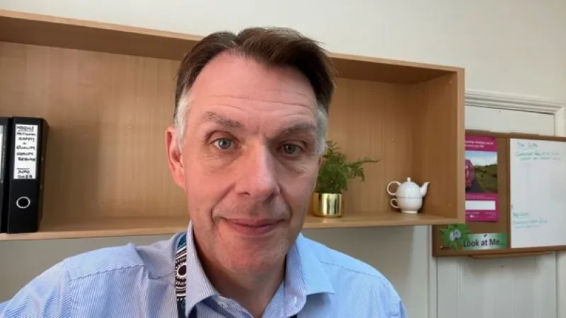 Close up of Andrew in his office