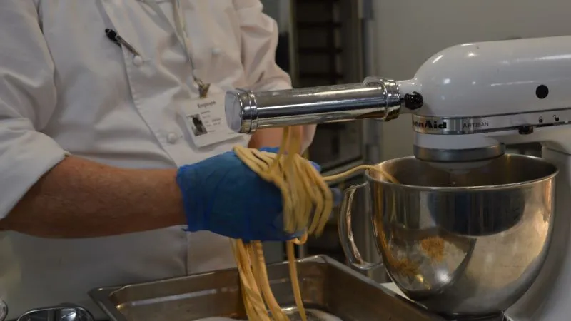 Kitchen staff at BaptistCare Orana making spaghetti from scratch