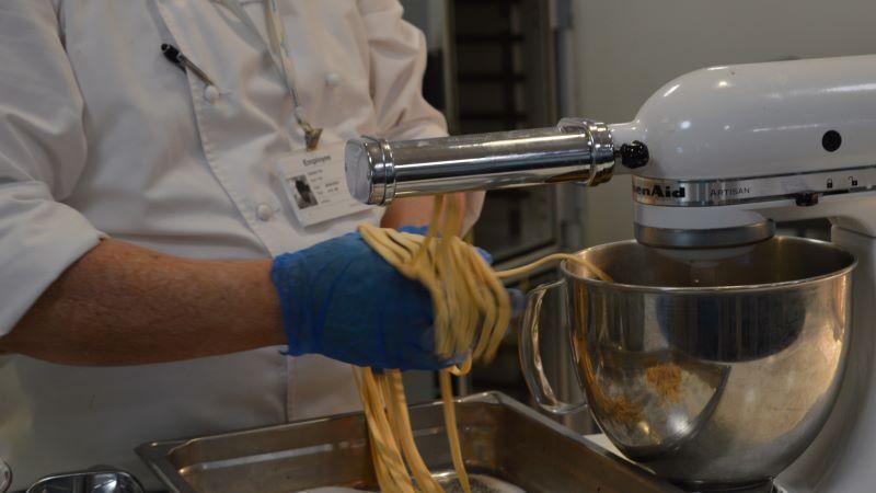Kitchen staff at BaptistCare Orana making spaghetti from scratch