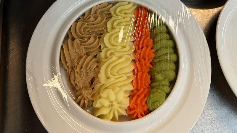 Plate of 4 different types of texture modified food.