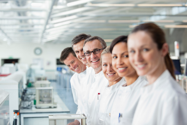 Several lab technicians standing in a row