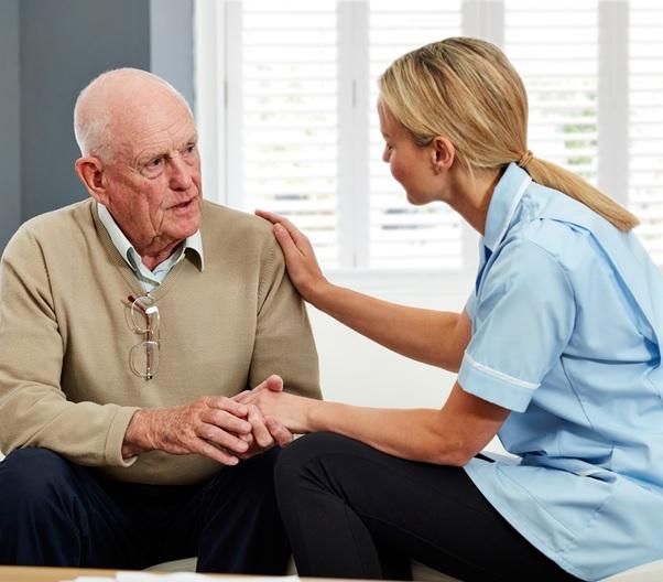 older person talking with medical professional
