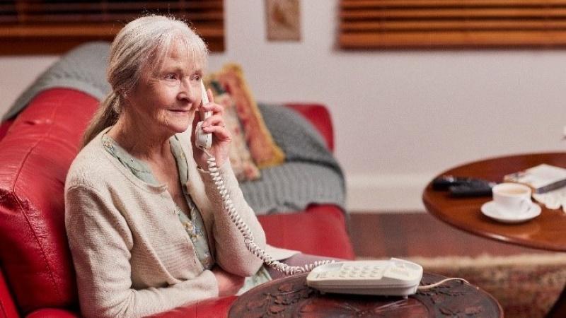 Elderly woman on the phone at home