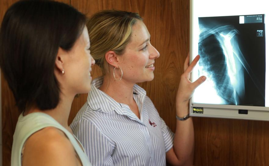 Two medical officers looking at an xray