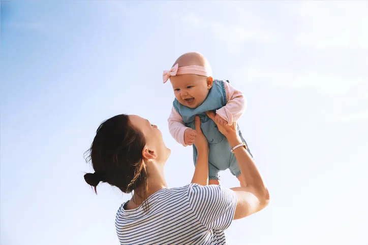 Photo of a mother holding her infant
