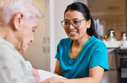Nurse helping an elderly aged care patient
