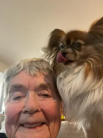 Photograph of Robyn with her two trick-trained Papillons