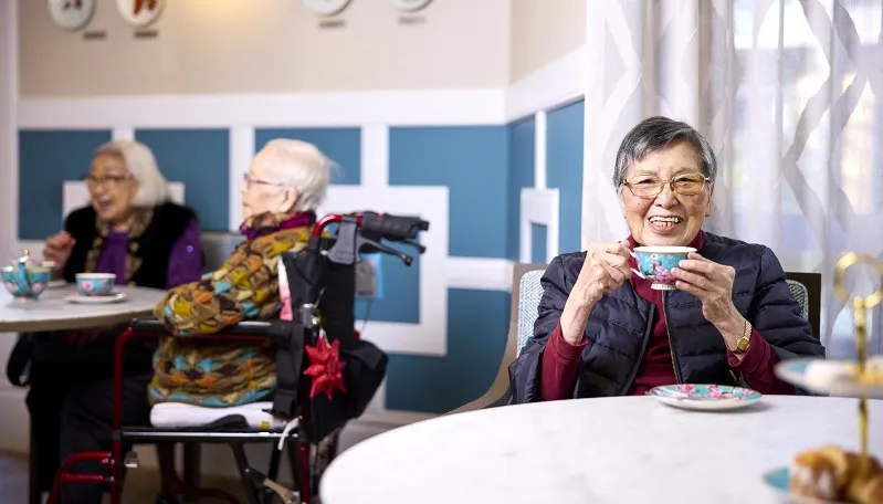 Female aged care resident with a cup of tea