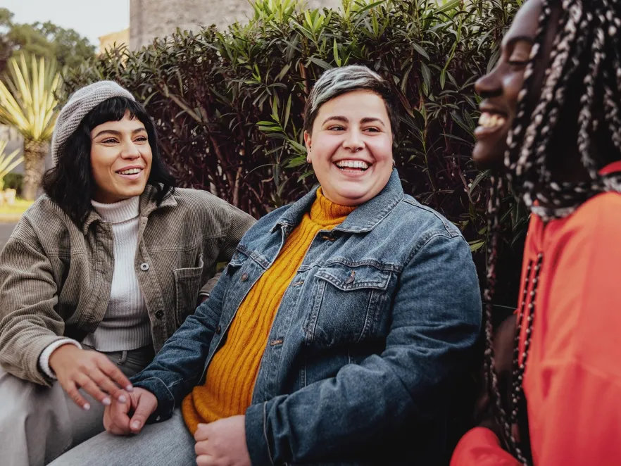 Three young women of different ethnicity having a discussion