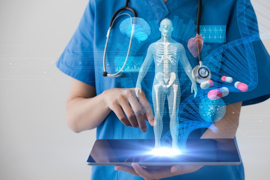 Hologram of a human skeleton on top of a computer tablet