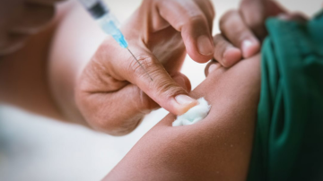 person receiving a vaccine injection