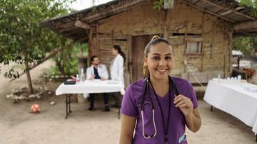 Nurse pictured in front of rural clinic