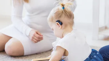 Child with hearing aid