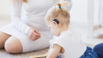 Child with hearing aid