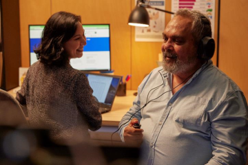 Image of a man receiving a hearing test. 