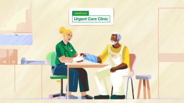 Doctor examining a hand injury at Medicare Urgent Care Clinic