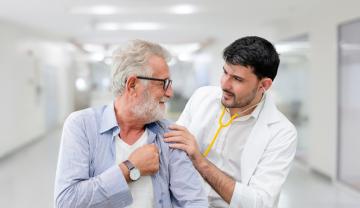 Photographic image of GP with a elderly patient