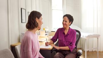 Female doctor and patient discussing health matters