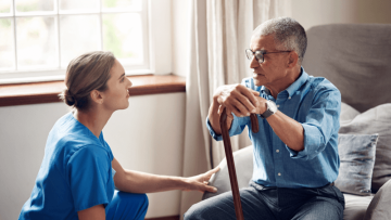 Senior man receiving support from a nurse