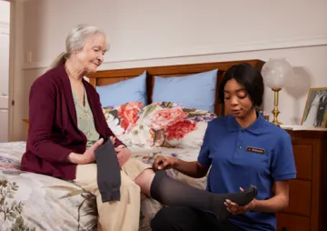 Image of an older woman and a nurse