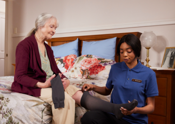 Image of an older woman and a nurse
