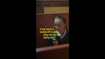 Girl vaping in a toilet stall