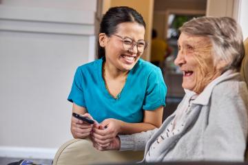 Image of an aged care worker with an older woman