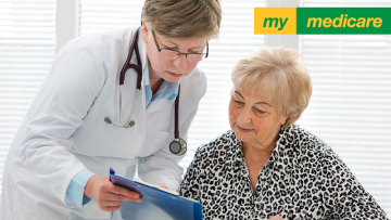 GP consulting with elderly female