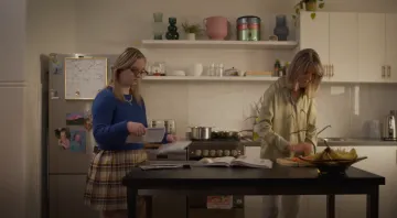 Video still of 2 women in a kitchen