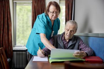 male aged care resident with aged care worker