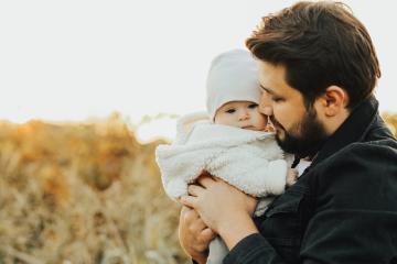 Image of a Father with their infant child