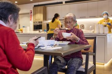 Photo of older ethic women eating