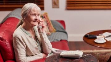 Elderly woman on the phone at home